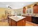 Bright kitchen with a central island and an adjacent dining area at 977 Frog Leap Trail Nw, Kennesaw, GA 30152