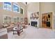 Inviting living room with soaring ceilings, fireplace, and large windows for abundant natural light at 977 Frog Leap Trail Nw, Kennesaw, GA 30152