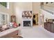 Bright living room with a cozy fireplace and elegant decor at 977 Frog Leap Trail Nw, Kennesaw, GA 30152