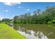 Scenic view of a tranquil pond, perfect for relaxation and enjoying nature at 977 Frog Leap Trail Nw, Kennesaw, GA 30152