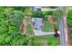 An aerial view showcases the verdant landscaping and lovely lawn surrounding this home at 1818 Mcconnell Rd, Grayson, GA 30017
