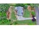 An aerial view highlights the lawn and landscaping surrounding this lovely home at 1818 Mcconnell Rd, Grayson, GA 30017