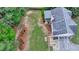 An aerial view reveals the lawn, landscaping, and screened porch of this home at 1818 Mcconnell Rd, Grayson, GA 30017