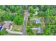 This aerial view showcases the verdant landscaping and mature trees around this home at 1818 Mcconnell Rd, Grayson, GA 30017