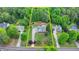 This aerial view highlights the mature trees and well-maintained landscaping surrounding this home at 1818 Mcconnell Rd, Grayson, GA 30017
