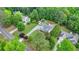 An aerial shot shows a home with a well-maintained lawn, set back from the street at 1818 Mcconnell Rd, Grayson, GA 30017