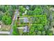 An aerial view of a landscaped property surrounded by mature trees within a defined boundary at 1818 Mcconnell Rd, Grayson, GA 30017