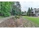 A spacious yard with lush grass and mature trees creating a serene outdoor setting at 1818 Mcconnell Rd, Grayson, GA 30017