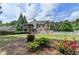 View of the back of the home showing the screened in porch and well manicured backyard at 1818 Mcconnell Rd, Grayson, GA 30017
