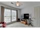 Bright room featuring a TV and a window at 1818 Mcconnell Rd, Grayson, GA 30017