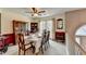 A formal dining area with natural light, and classic furniture, creating an elegant space for gatherings at 1818 Mcconnell Rd, Grayson, GA 30017