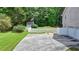 Long driveway leading to a two-car garage, complemented by a spacious, well-maintained lawn at 1818 Mcconnell Rd, Grayson, GA 30017