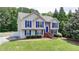 Attractive two-story home with a manicured lawn and a white picket fence at 1818 Mcconnell Rd, Grayson, GA 30017
