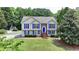 Traditional home with blue shutters, brick accents, and a spacious front yard at 1818 Mcconnell Rd, Grayson, GA 30017