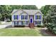 Lovely home with blue shutters and a well-kept lawn at 1818 Mcconnell Rd, Grayson, GA 30017