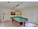 This game room features a pool table with pendant lighting and neutral colored walls at 1818 Mcconnell Rd, Grayson, GA 30017