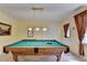 This game room features a pool table with pendant lighting and neutral colored walls at 1818 Mcconnell Rd, Grayson, GA 30017
