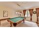 Spacious game room featuring a pool table and soft lighting, ideal for entertainment and relaxation at 1818 Mcconnell Rd, Grayson, GA 30017