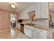 Well-maintained kitchen with white cabinets, stainless steel appliances, and plenty of counter space at 1818 Mcconnell Rd, Grayson, GA 30017