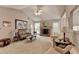 Bright living room with a brick fireplace and neutral decor, creating a comfortable and inviting space for relaxation at 1818 Mcconnell Rd, Grayson, GA 30017