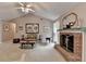 Cozy living room featuring a classic fireplace with a brick surround and mantle at 1818 Mcconnell Rd, Grayson, GA 30017