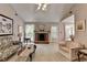 Bright living room featuring a fireplace and large windows for natural light at 1818 Mcconnell Rd, Grayson, GA 30017