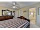 The main bedroom features a decorative ceiling fan and attached ensuite bathroom at 1818 Mcconnell Rd, Grayson, GA 30017