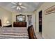 Large main bedroom with decorative ceiling fan, closet access, and a well-maintained interior at 1818 Mcconnell Rd, Grayson, GA 30017