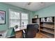 Bright home office featuring wood floors, a ceiling fan, and functional decor, perfect for productivity at 1818 Mcconnell Rd, Grayson, GA 30017