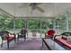 Relaxing screened porch with comfortable seating, offering a serene view of the private backyard at 1818 Mcconnell Rd, Grayson, GA 30017
