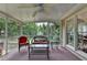 Cozy screened-in porch, furnished for relaxing, with views of the lush, green backyard at 1818 Mcconnell Rd, Grayson, GA 30017