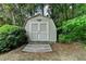 Charming shed nestled among trees, offering additional storage at 1818 Mcconnell Rd, Grayson, GA 30017