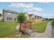 Backyard view of wooden bridge and walking path, lush green grass, and fence at 2493 Oakleaf Rdg, Lithonia, GA 30058