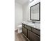 Bathroom featuring single vanity with granite counters and black hardware at 2493 Oakleaf Rdg, Lithonia, GA 30058
