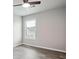 Bedroom with wood-look floors, a ceiling fan, and a window with blinds at 2493 Oakleaf Rdg, Lithonia, GA 30058