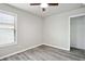 Bedroom with wood-look floors, a ceiling fan, a window with blinds and closet at 2493 Oakleaf Rdg, Lithonia, GA 30058