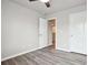 Bedroom with wood-look floors, ceiling fan and two closets at 2493 Oakleaf Rdg, Lithonia, GA 30058