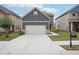 Charming two-story home with a two car garage, landscaped front yard and craftsman style accents at 2493 Oakleaf Rdg, Lithonia, GA 30058