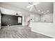 Large living area with wood floors, ceiling fan, bar seating, and recessed lighting at 2493 Oakleaf Rdg, Lithonia, GA 30058