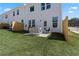 Cozy backyard with a small patio and modern outdoor furniture, enclosed by a charming wooden fence at 336 Heavenly Hollow Pl, Mcdonough, GA 30253