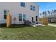 A modern backyard with manicured lawn, small patio, contemporary seating, and privacy fence at 336 Heavenly Hollow Pl, Mcdonough, GA 30253