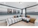 A shared bedroom with matching beds, striped decor and interesting framed art at 336 Heavenly Hollow Pl, Mcdonough, GA 30253