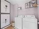 A well-lit laundry room with modern appliances and stylish decor at 336 Heavenly Hollow Pl, Mcdonough, GA 30253