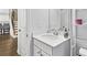 Modern bathroom featuring a quartz countertop and access to the upstairs hallway at 49 Ryder Pass Way, Loganville, GA 30052