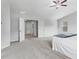 Large bedroom featuring a ceiling fan and an open layout to ensuite bathroom with natural light at 49 Ryder Pass Way, Loganville, GA 30052