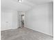 Spacious bedroom with a neutral color palette, carpeted flooring, and ample closet space at 49 Ryder Pass Way, Loganville, GA 30052