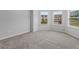 This bedroom has three windows that fill the room with natural light at 49 Ryder Pass Way, Loganville, GA 30052