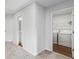 Hallway featuring a laundry room and bathroom at 49 Ryder Pass Way, Loganville, GA 30052