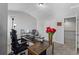 Bright home office with desk, chair, white walls, and view to open doorway at 49 Ryder Pass Way, Loganville, GA 30052
