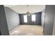 Bedroom with carpeted floor, ceiling fan, and two windows letting in natural light at 497 Prince Of Wales, Stone Mountain, GA 30083